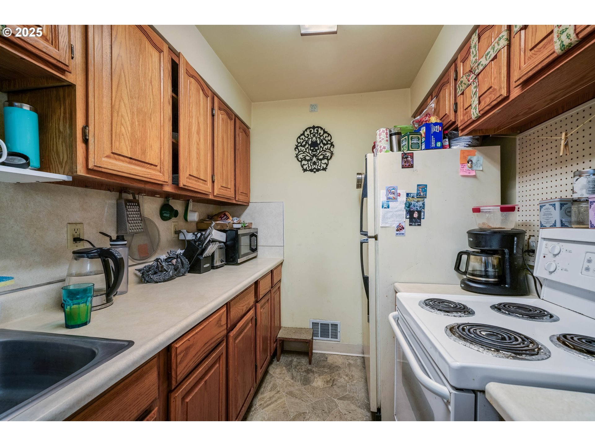 1908 Northeast 72nd Avenue Portland, OR 97213 - Photo 43 of 45 a kitchen with stainless steel appliances granite countertop a sink stove and refrigerator