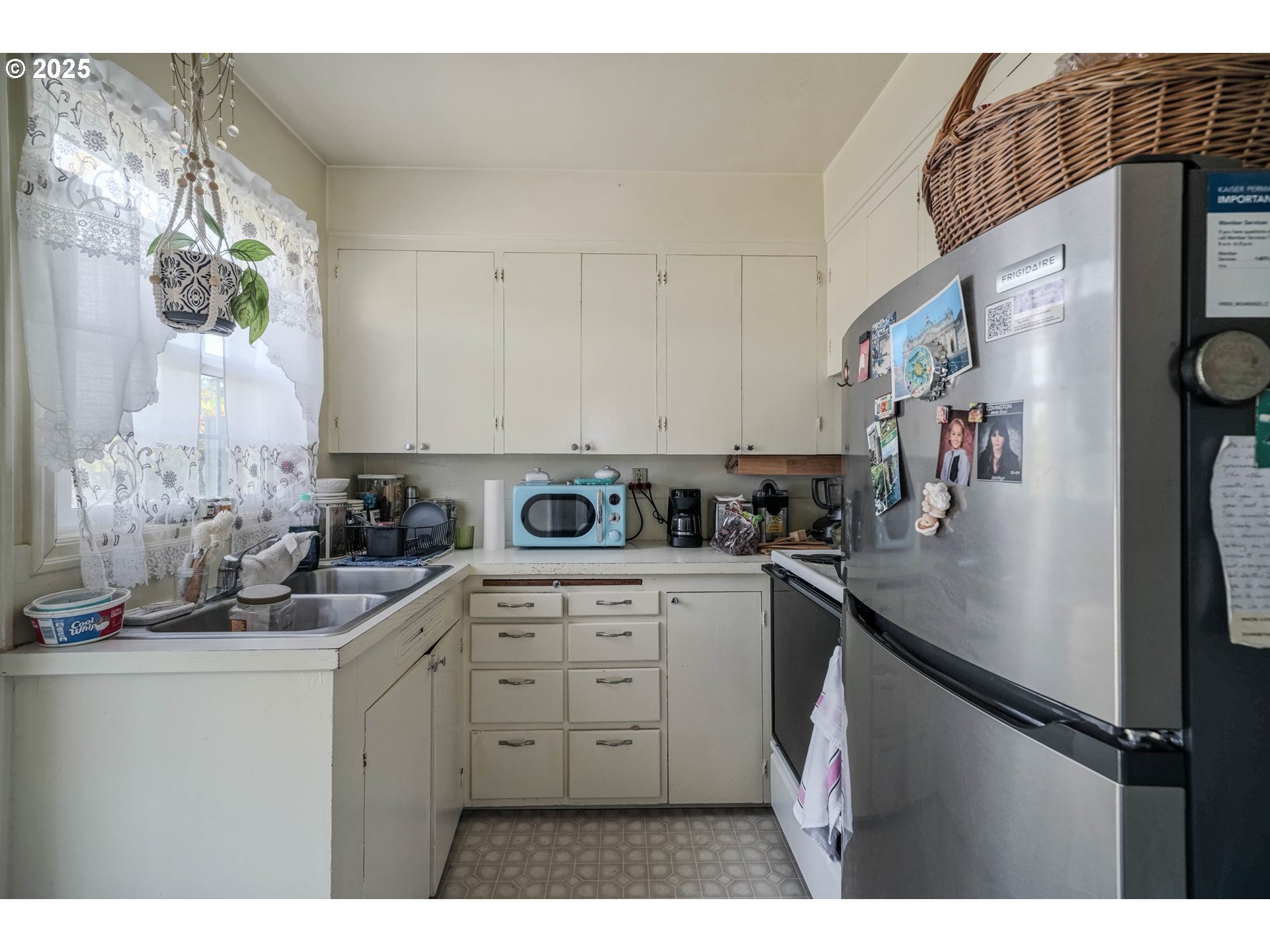 1908 Northeast 72nd Avenue Portland, OR 97213 - Photo 6 of 45 a kitchen with stainless steel appliances a sink a stove and white cabinets