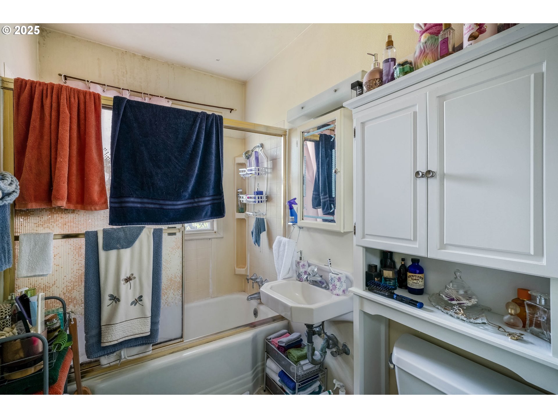 1908 Northeast 72nd Avenue Portland, OR 97213 - Photo 8 of 45 a bathroom with a sink a mirror and cabinets