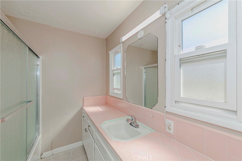 9002 Imperial Avenue Garden Grove, CA 92844 - Photo 11 of 20 a bathroom with a sink and a mirror