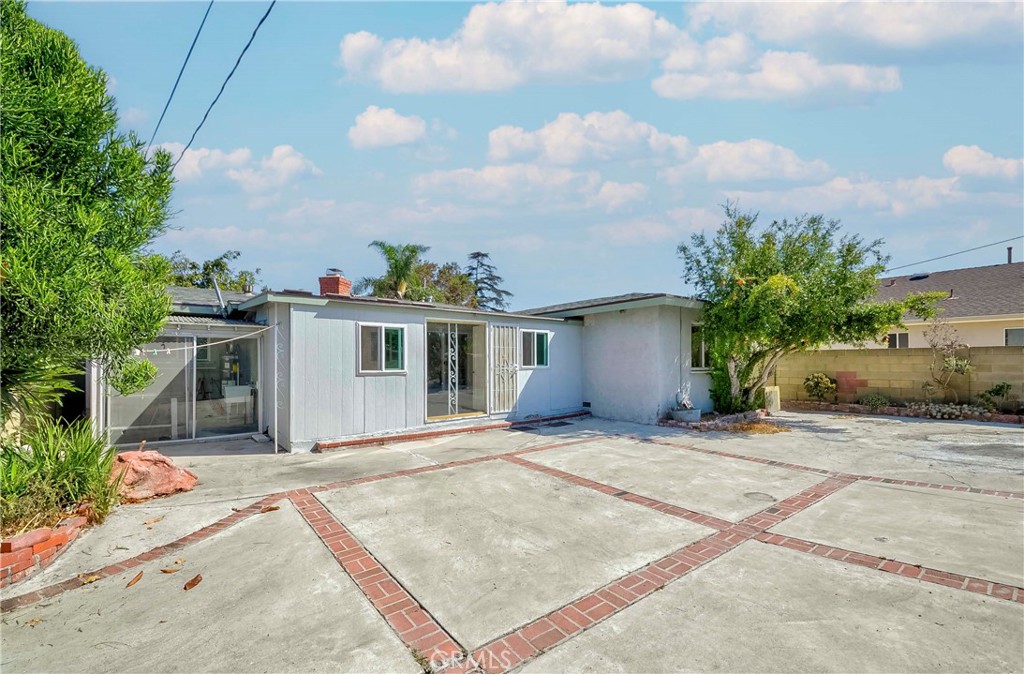 9002 Imperial Avenue Garden Grove, CA 92844 - Photo 4 of 20 a view of a house with backyard and garden