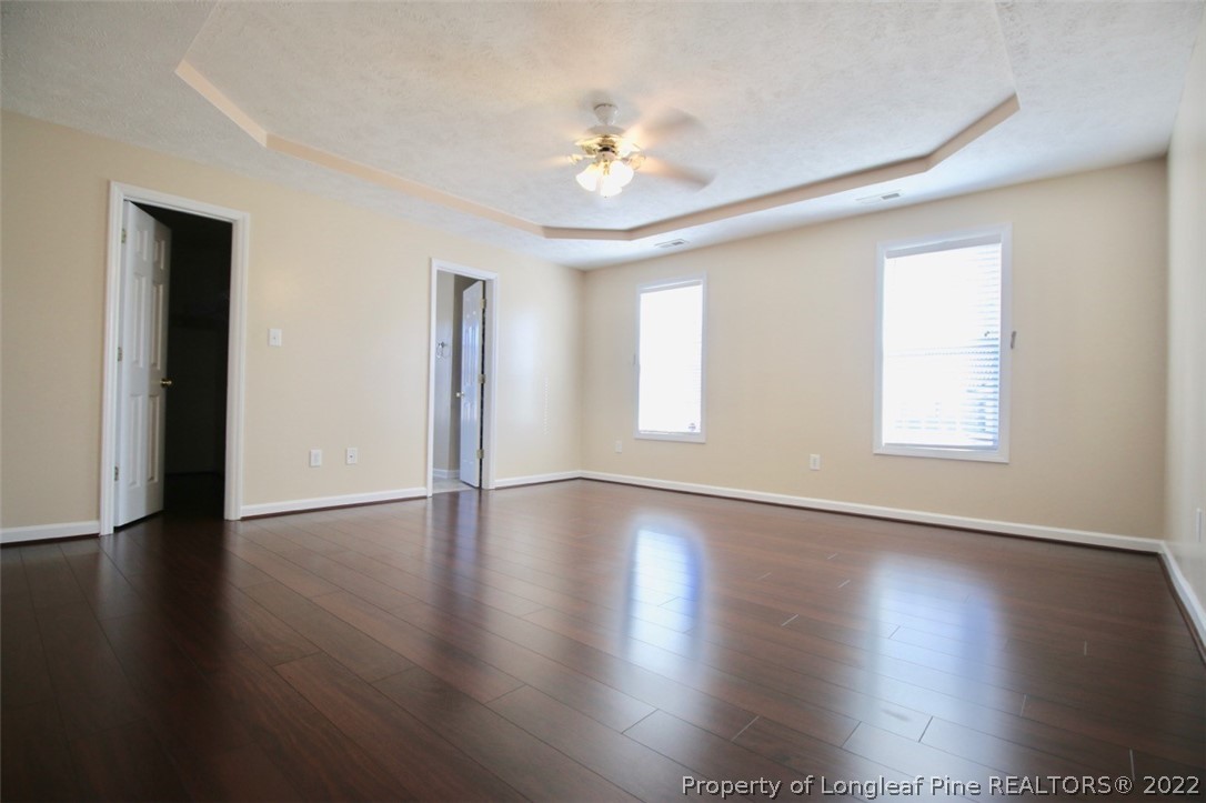 2004 Ivey Commons Road Fayetteville, NC 28306 - Photo 11 of 21 a view of an empty room with wooden floor and a window