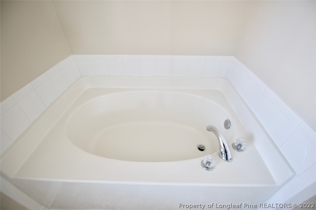 2004 Ivey Commons Road Fayetteville, NC 28306 - Photo 13 of 21 a bathroom with a bathtub