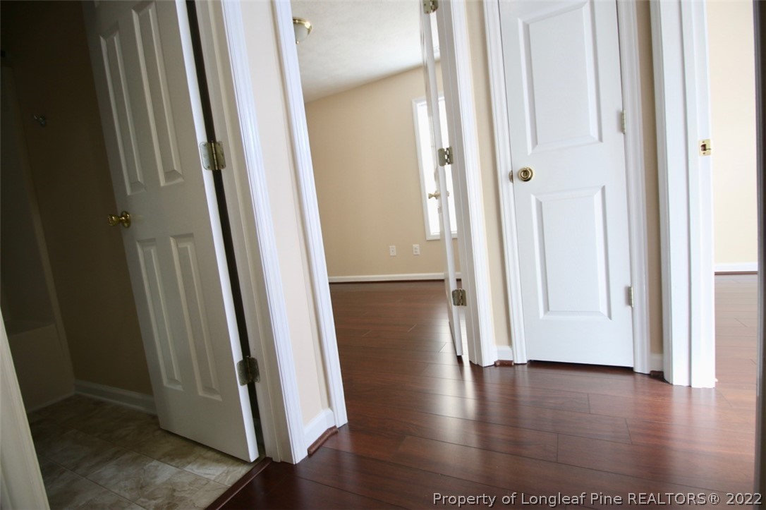 2004 Ivey Commons Road Fayetteville, NC 28306 - Photo 16 of 21 an empty room with wooden floor and entrance