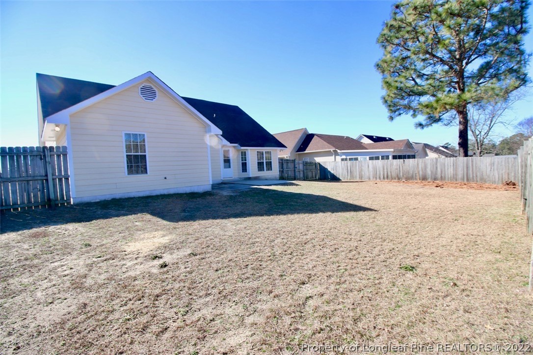 2004 Ivey Commons Road Fayetteville, NC 28306 - Photo 20 of 21 a view of a house with a yard and covered with snow