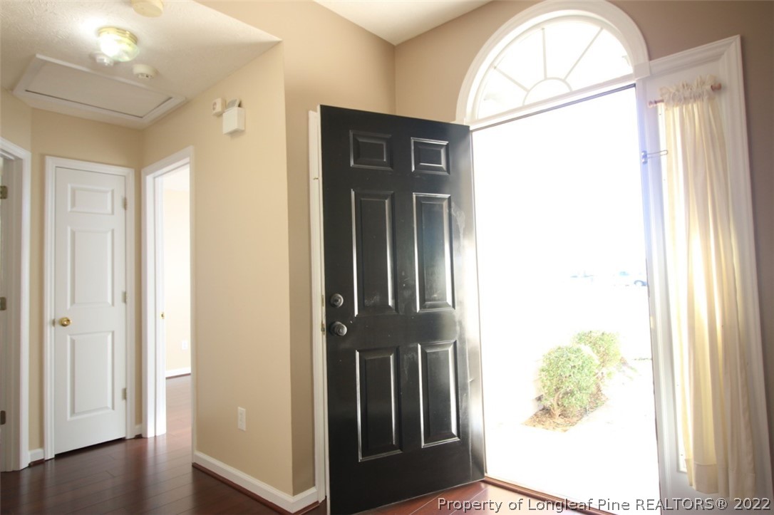2004 Ivey Commons Road Fayetteville, NC 28306 - Photo 3 of 21 a view of a hallway with wooden floor windows and entryway