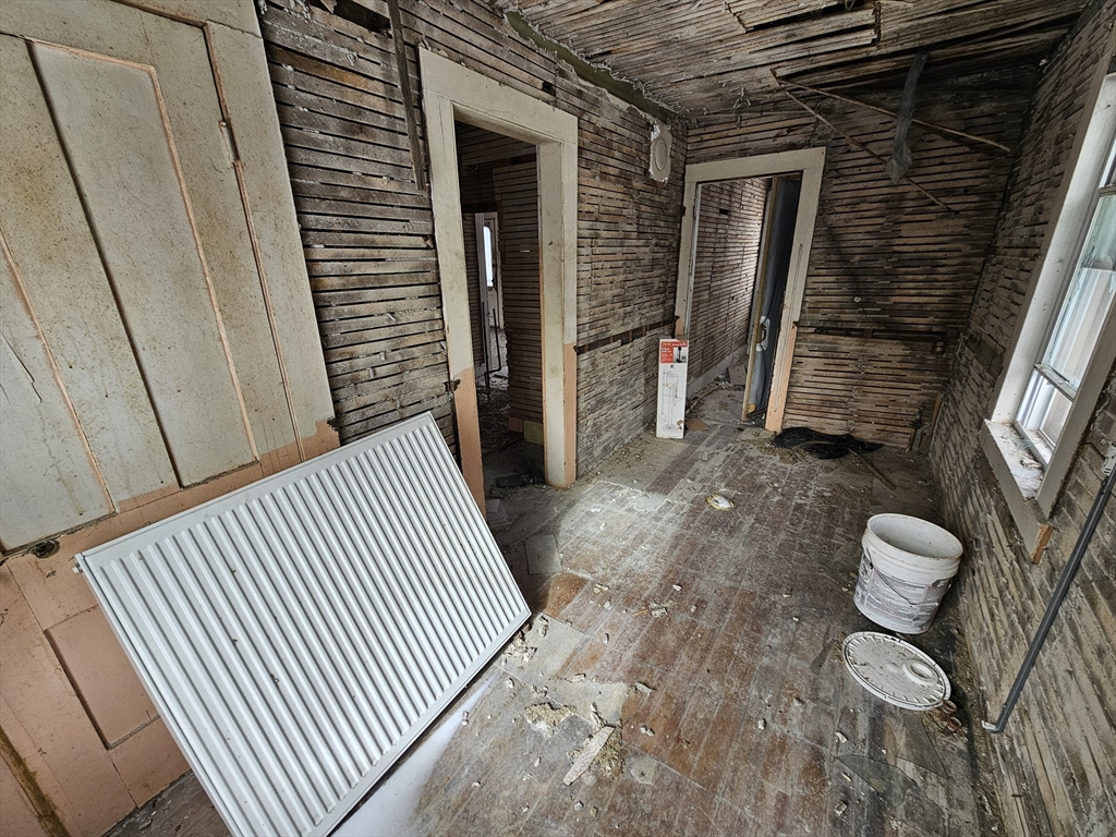 56 Liberty Street North Adams, MA 01247 - Photo 18 of 32 a view of a room with wooden floor and chair