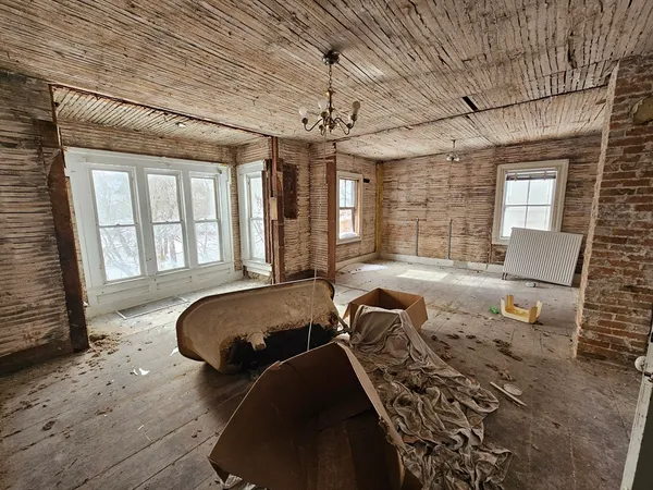 a view of an empty room with a fireplace