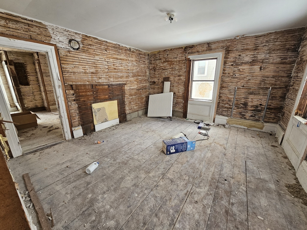 56 Liberty Street North Adams, MA 01247 - Photo 24 of 32 a view of an empty room with a fireplace