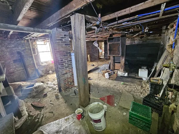 a view of a white house with a yard