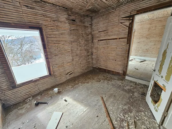 a view of a room with brick walls