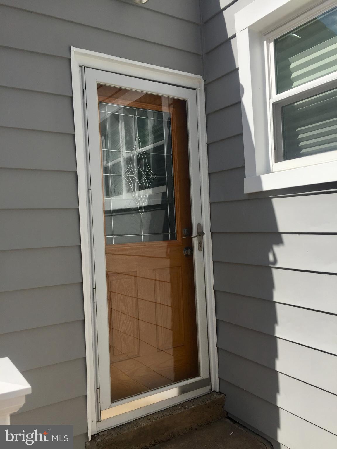 232 Sedgewood Road Springfield, PA 19064 - Photo 34 of 37 rear door to back yard and parking