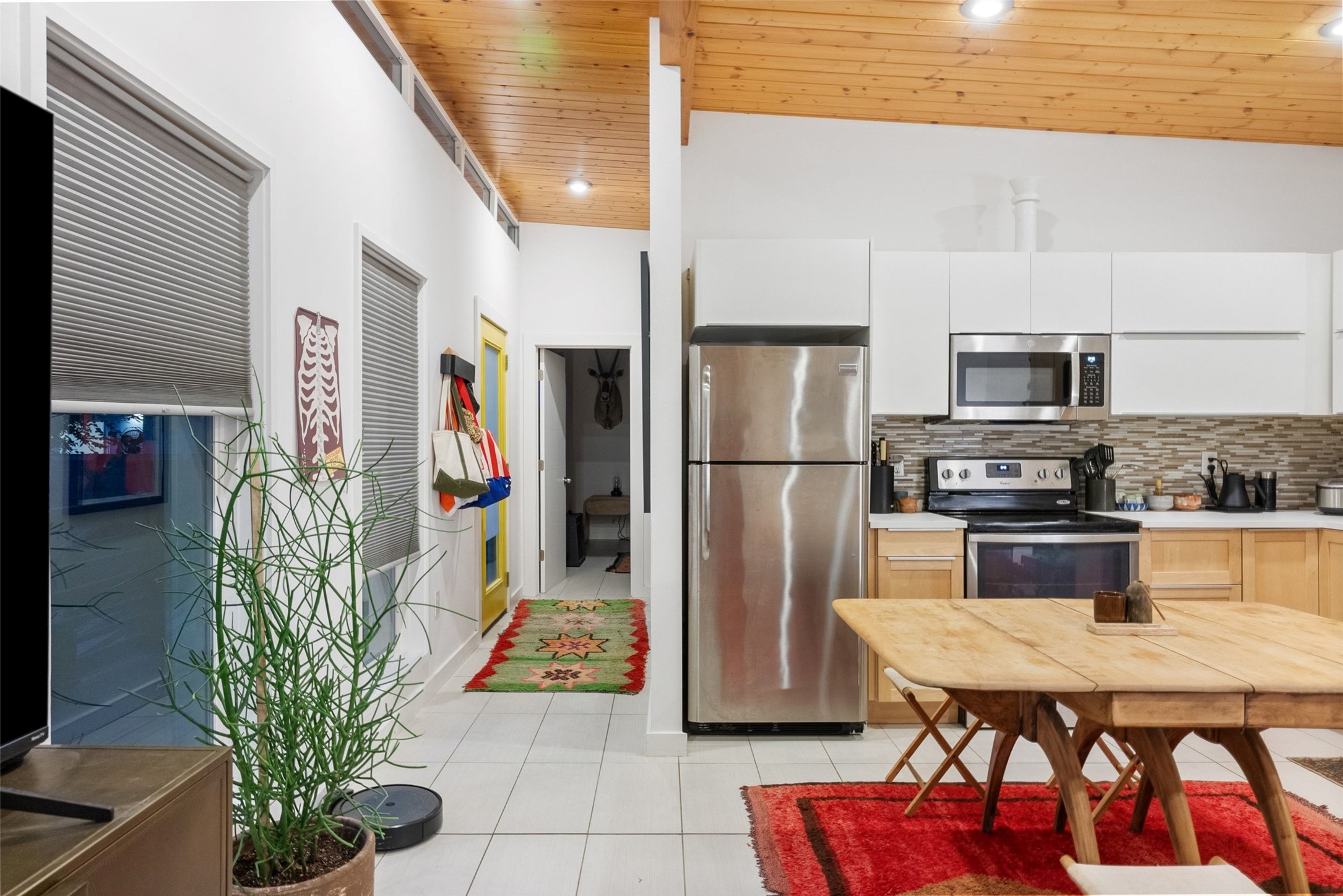 412 West Croslin Street Austin, TX 78752 - Photo 27 of 36 Clean lines and a spacious layout define this modern culinary space with warm wood accents.