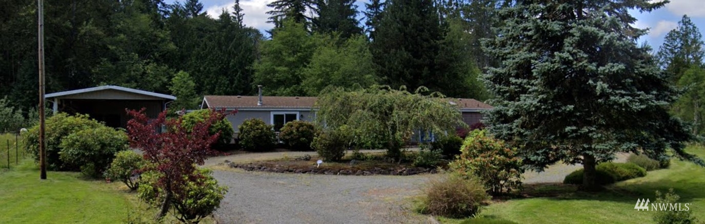 18720 Fales Road Snohomish, WA 98296 - Photo 1 of 1 a view of a house with a yard and plants