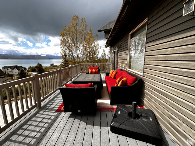 1940 East Shore Road St. Charles, ID 83272 - Photo 11 of 64 Deck featuring outdoor seating and a water view