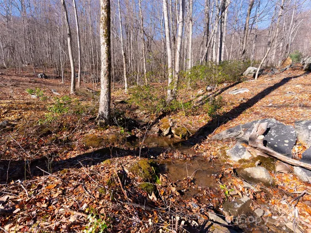 a view of outdoor space with wooden fence