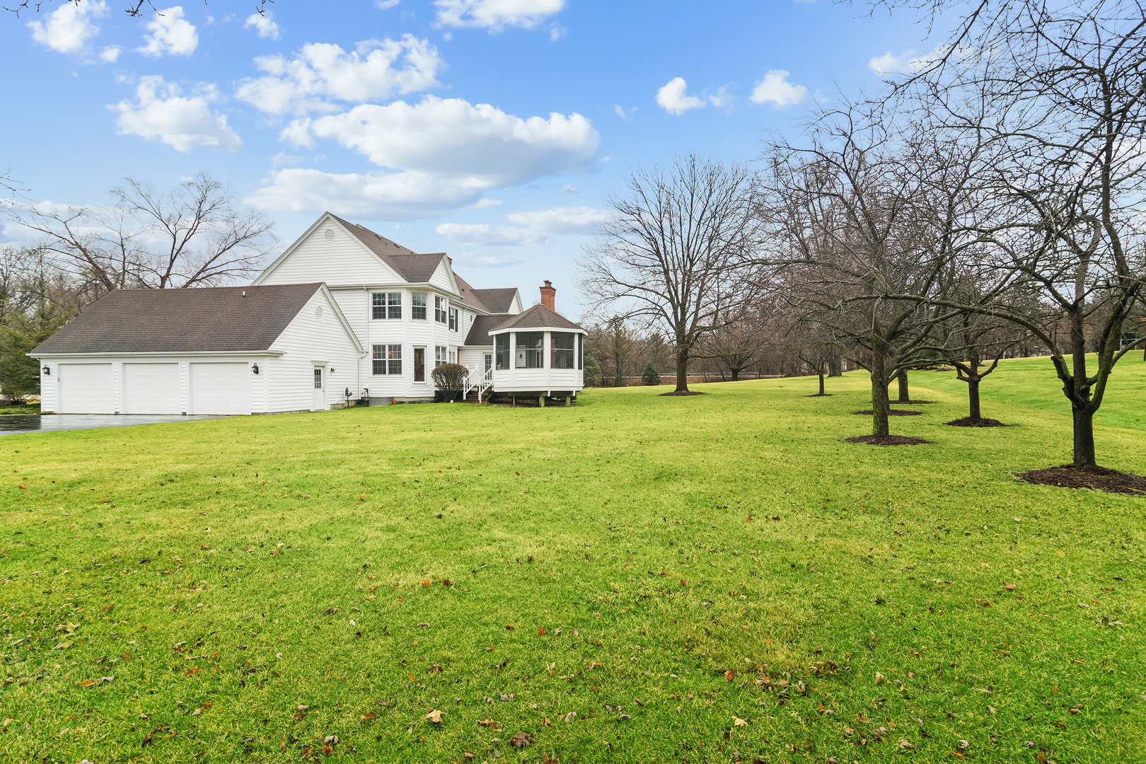 23466 West Redwing Place Barrington, IL 60010 - Photo 2 of 35 a view of a house with a big yard and a large tree