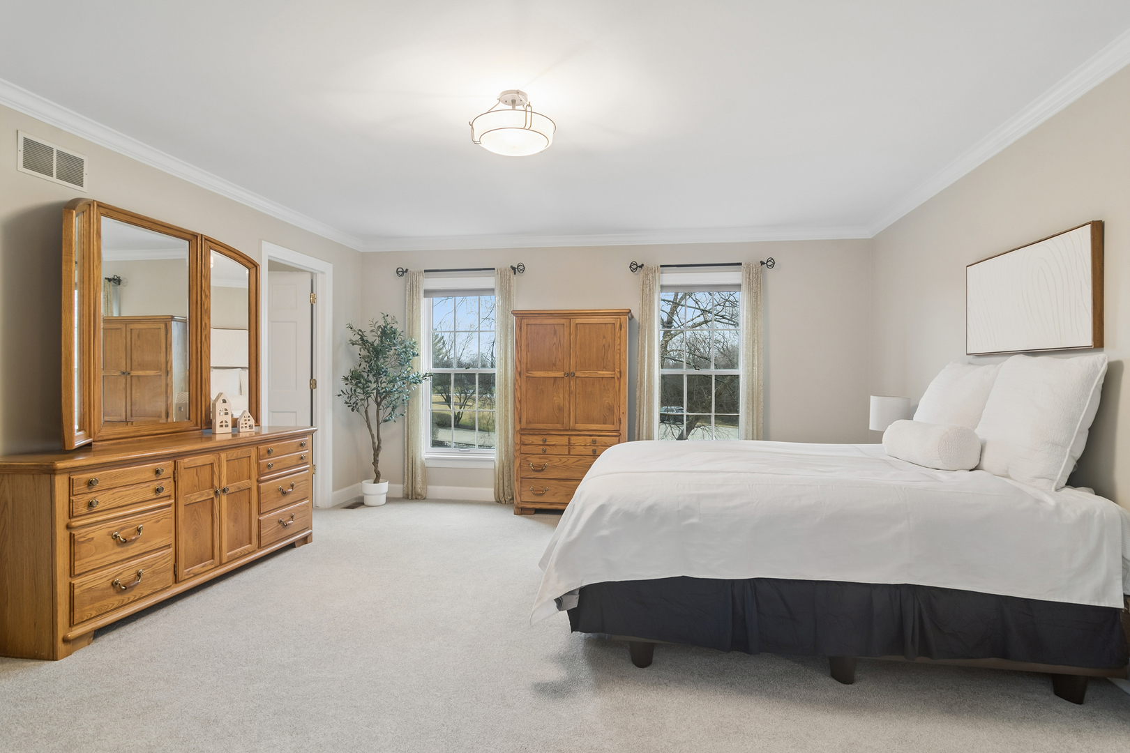 23466 West Redwing Place Barrington, IL 60010 - Photo 21 of 35 a spacious bedroom with a large bed and a dresser