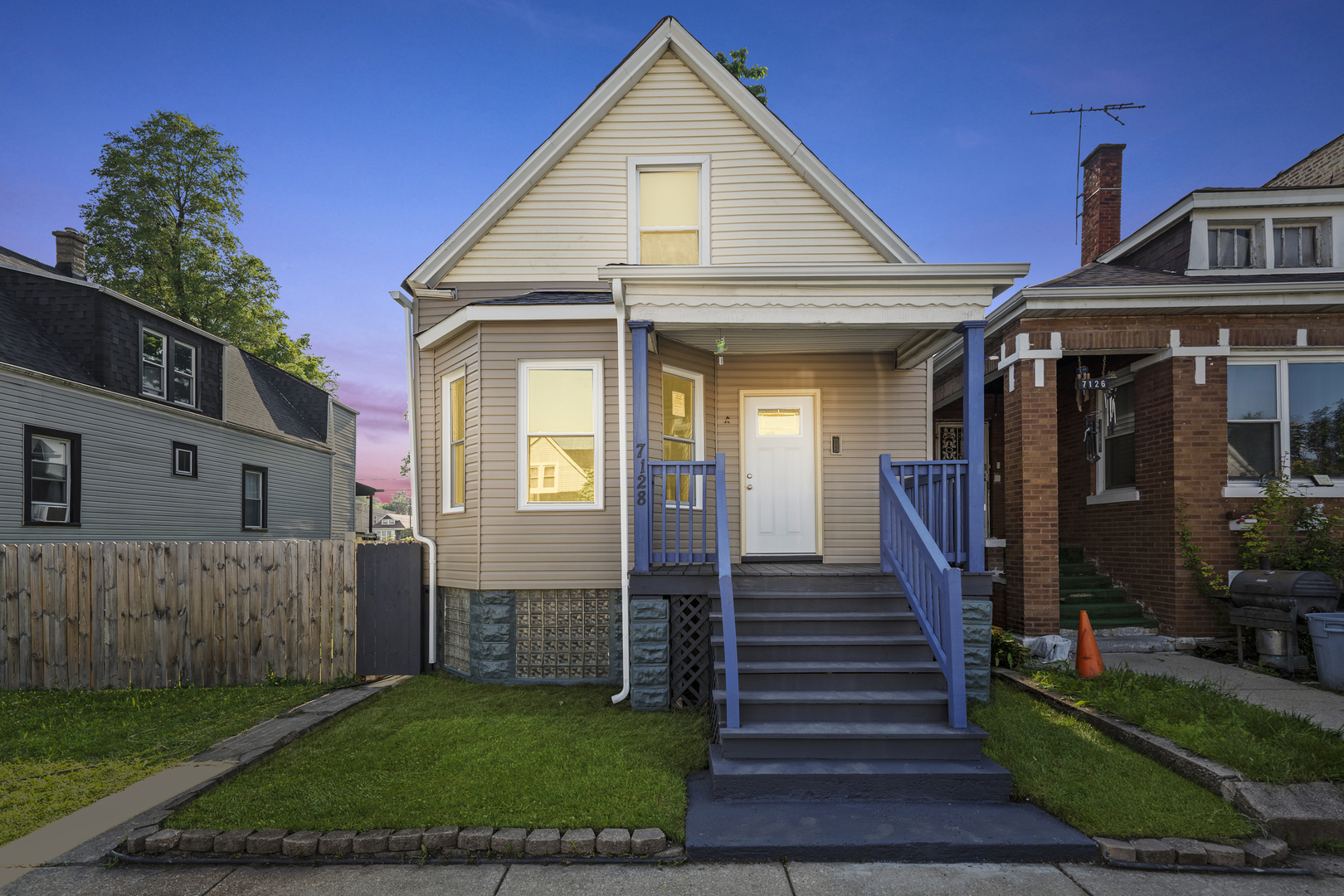 7128 South May Street Chicago, IL 60621 - Photo 1 of 32 a front view of a house with a yard