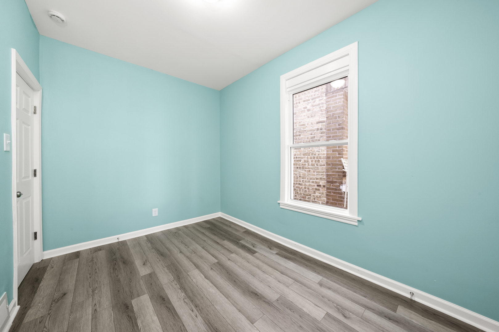 7128 South May Street Chicago, IL 60621 - Photo 18 of 32 a view of a room that has a window in it