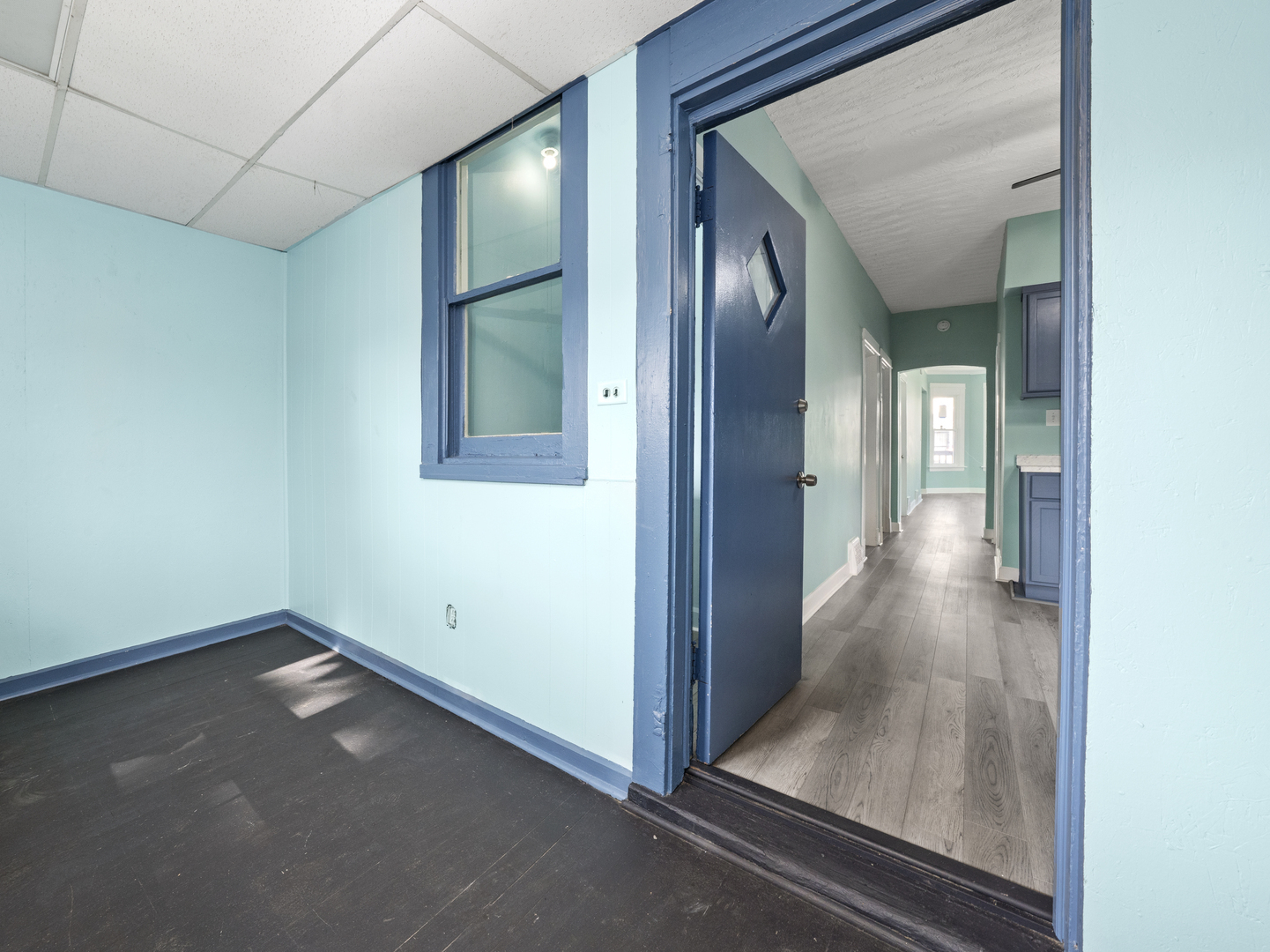 7128 South May Street Chicago, IL 60621 - Photo 27 of 32 a view of a hallway with wooden floor
