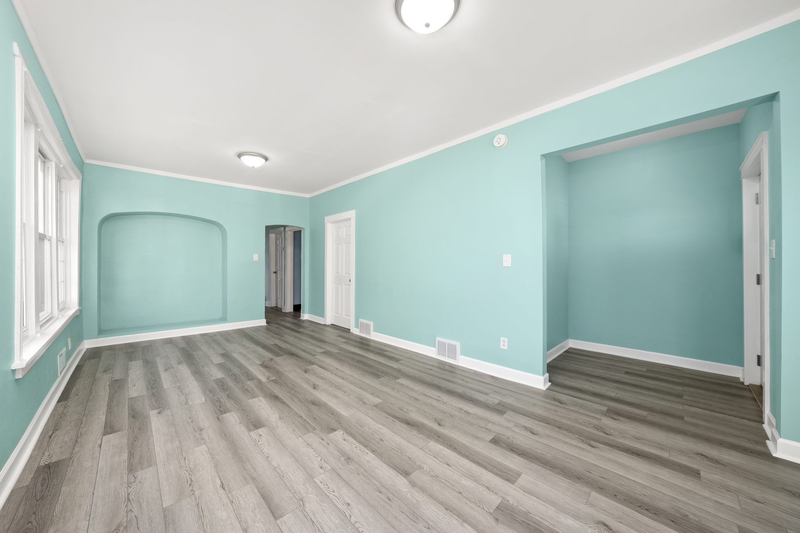 7128 South May Street Chicago, IL 60621 - Photo 5 of 32 a view of empty room with wooden floor