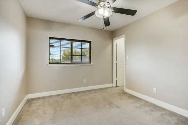 a bedroom with bed and a couch