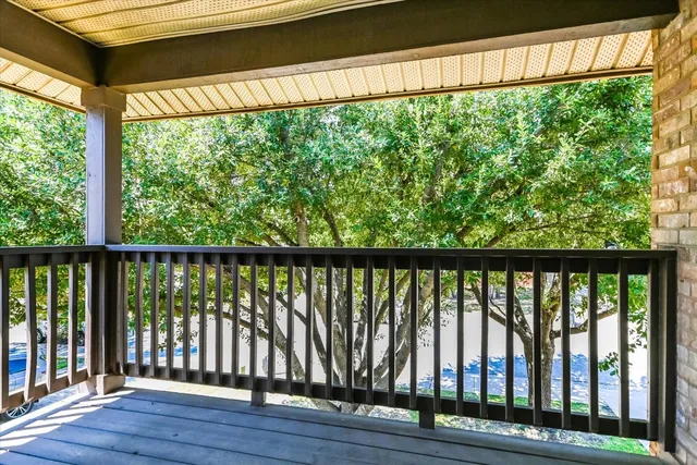 a view of a backyard with a garden and tree