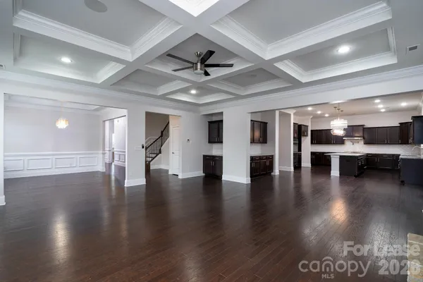 a view of a hall with wooden floor
