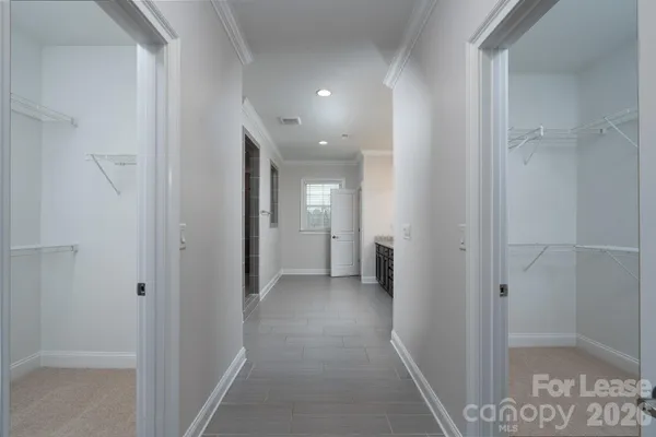 a view of a hallway with a room