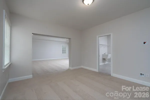 a view of an empty room and window