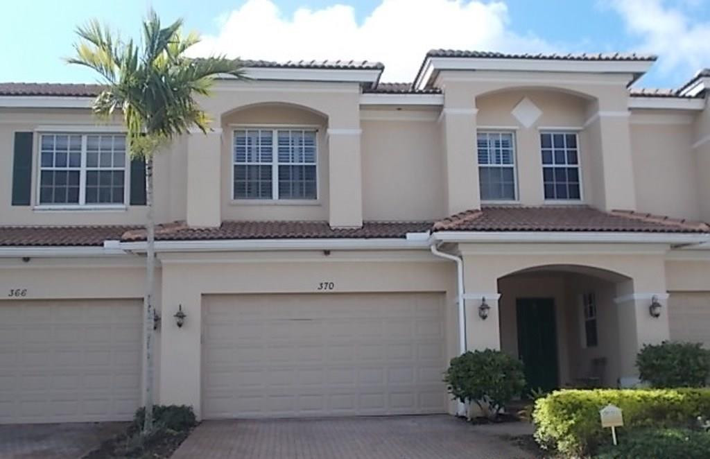 370 Southwest Walking Path, Unit 370 Stuart, FL 34997 - Photo 1 of 38 Front with paver driveway