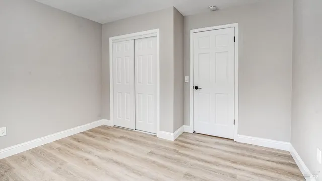 a bedroom with a bed and a view of bathroom