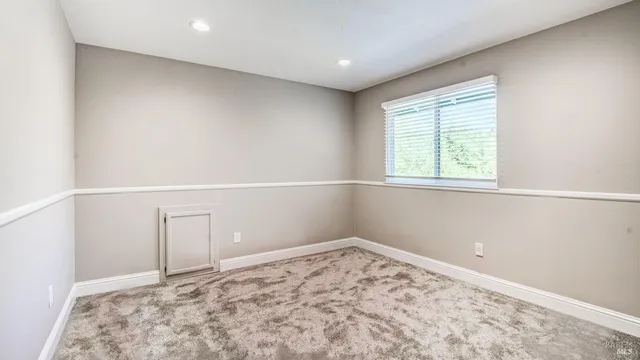 a view of a swimming pool with a patio and a yard