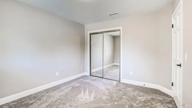 an aerial view of a house with a yard and garden