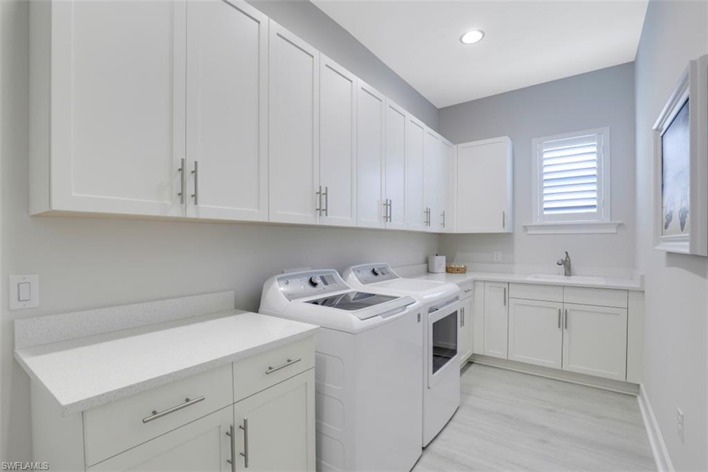 5771 Clarendon Drive Naples, FL 34113 - Photo 20 of 33 a view of a kitchen with sink and cabinets