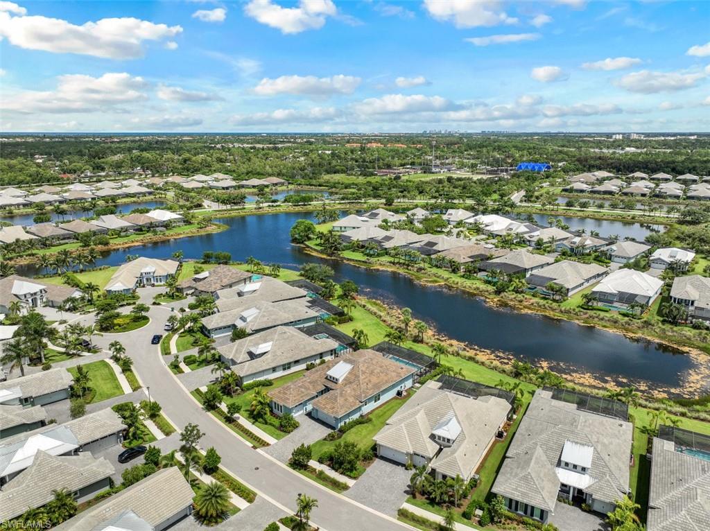 5771 Clarendon Drive Naples, FL 34113 - Photo 29 of 33 an aerial view of residential houses with outdoor space