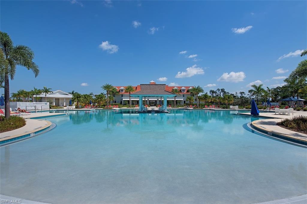 5771 Clarendon Drive Naples, FL 34113 - Photo 31 of 33 a view of swimming pool with outdoor seating and yard