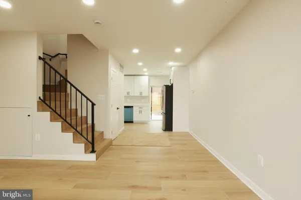 a view of a hallway with staircase