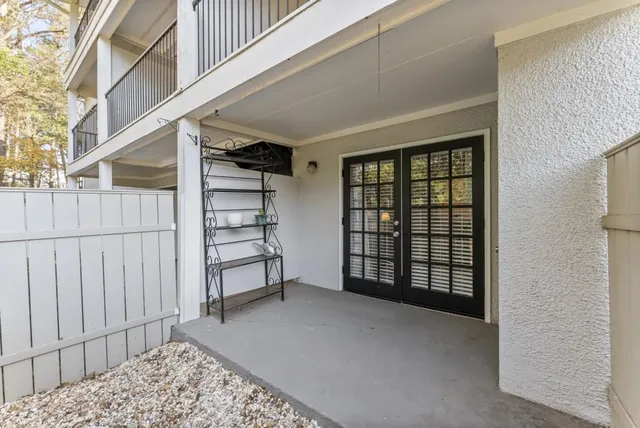 a view of a bedroom with furniture and window