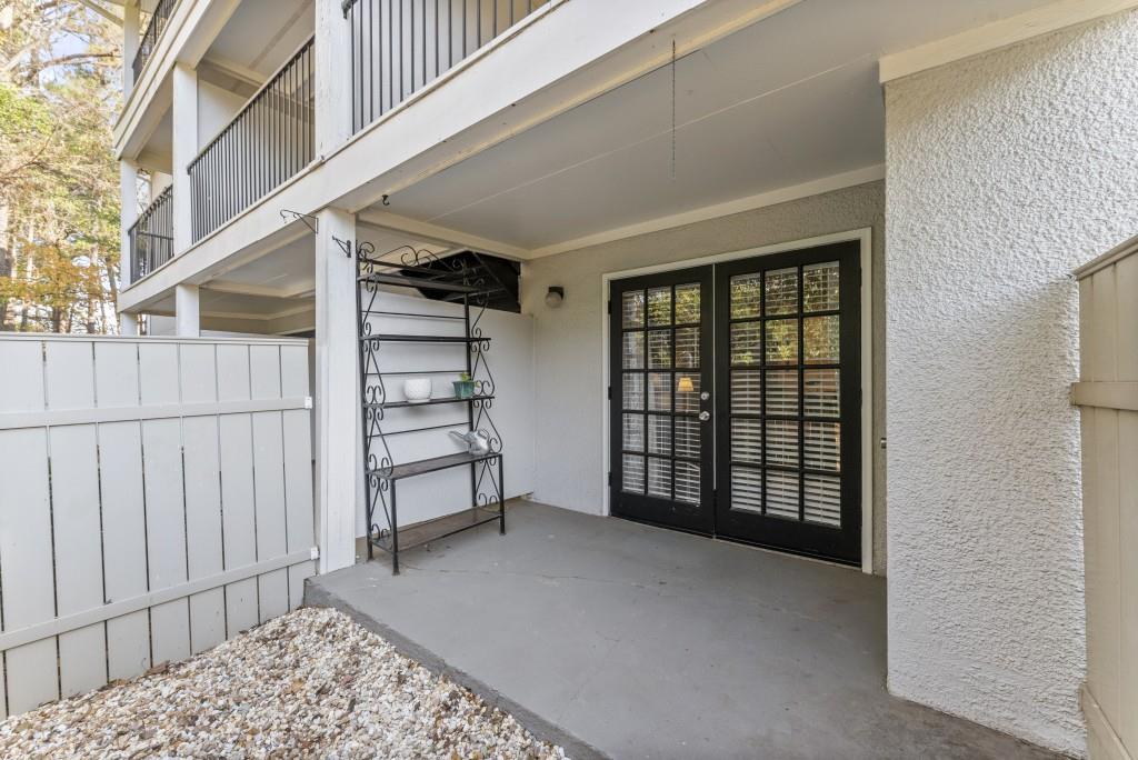 1150 Collier Road Northwest, Unit J18 Atlanta, GA 30318 - Photo 11 of 32 a view of a bedroom with furniture and window