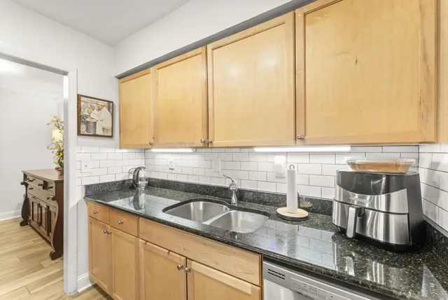 a kitchen with a sink and a window