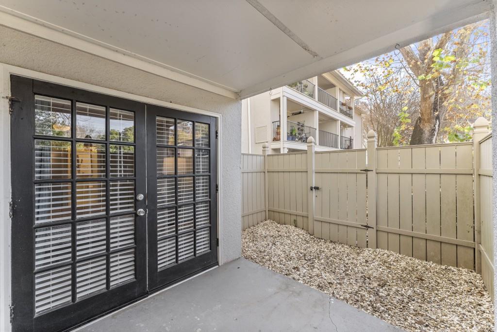 1150 Collier Road Northwest, Unit J18 Atlanta, GA 30318 - Photo 19 of 32 a view of a house with a balcony