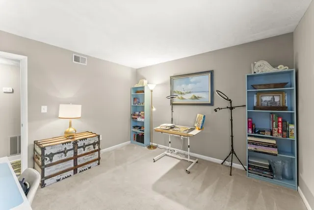 a bedroom with furniture and a wooden floor