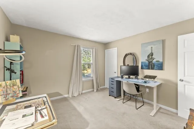 a view of a workspace with furniture