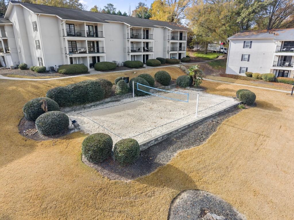 1150 Collier Road Northwest, Unit J18 Atlanta, GA 30318 - Photo 30 of 32 a view of a house with snow on the road