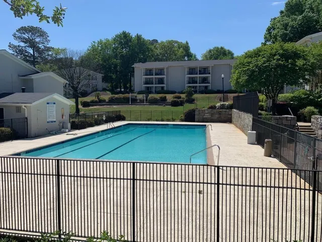a view of a swimming pool with a patio