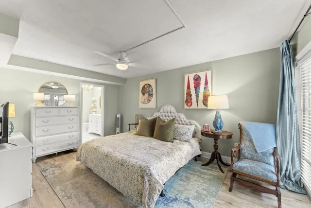 a bed room with a bed and a chair