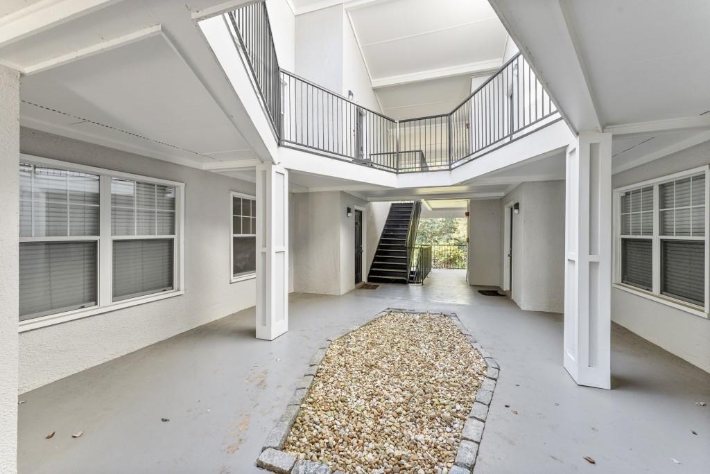 1150 Collier Road Northwest, Unit J18 Atlanta, GA 30318 - Photo 7 of 32 a view of livingroom with an empty space