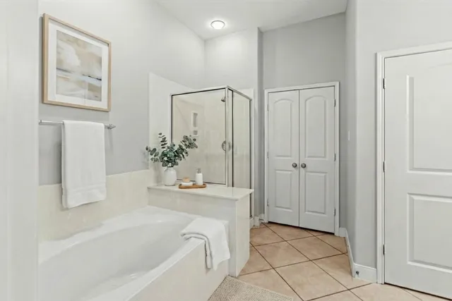 a white bath tub sitting next to a white sink